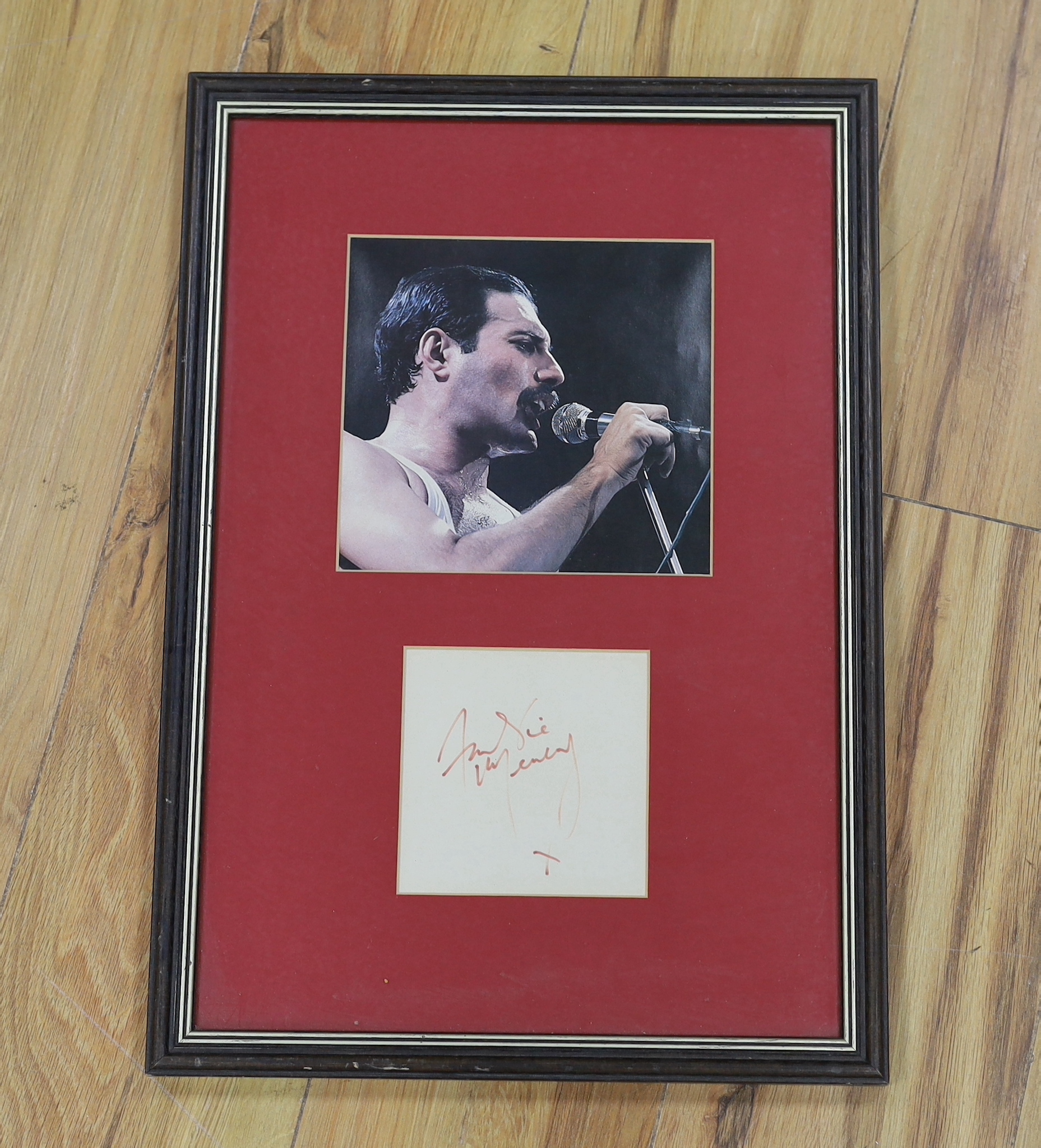 Freddie Mercury, framed autograph on paper, framed with a photograph, frame 48.5 x 34cm